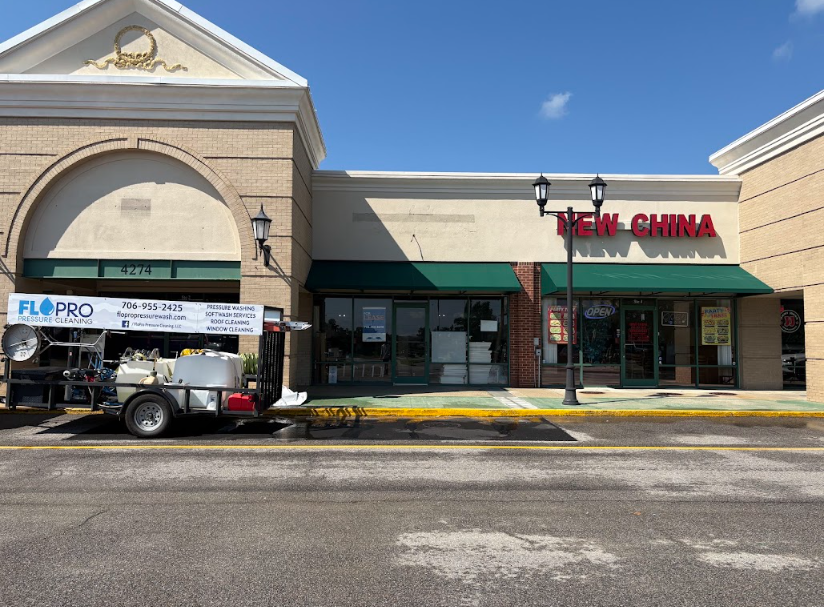FloPro equipment set up along a freshly cleaned commercial walkway at a retail plaza