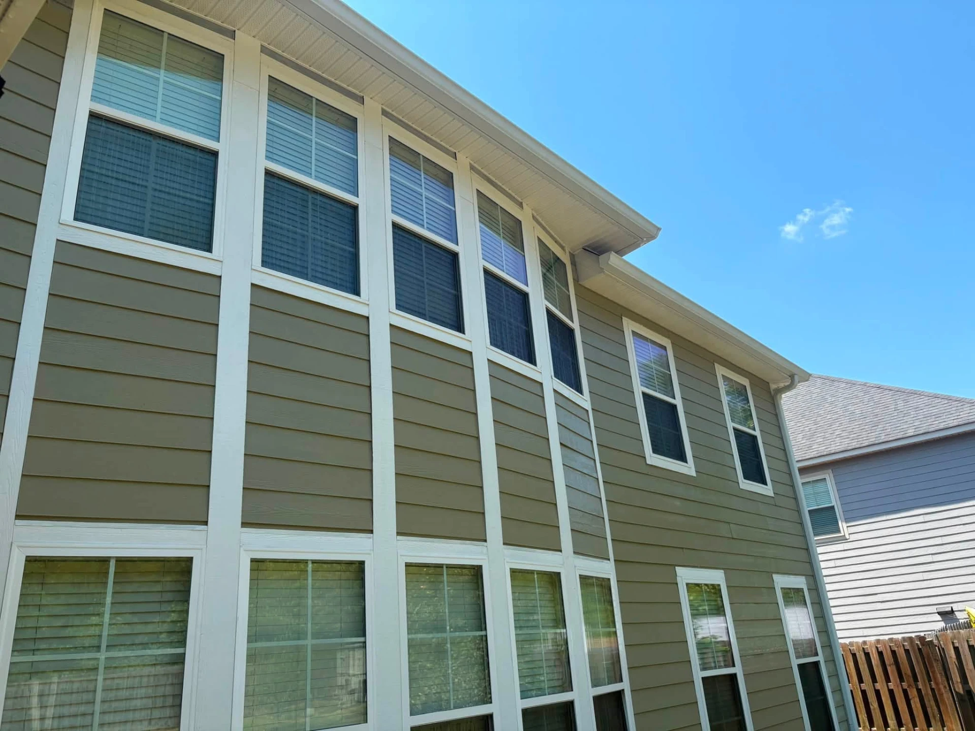 Siding, Soffit & Windows — drag to compare — after cleaning by FloPro Pressure Cleaning