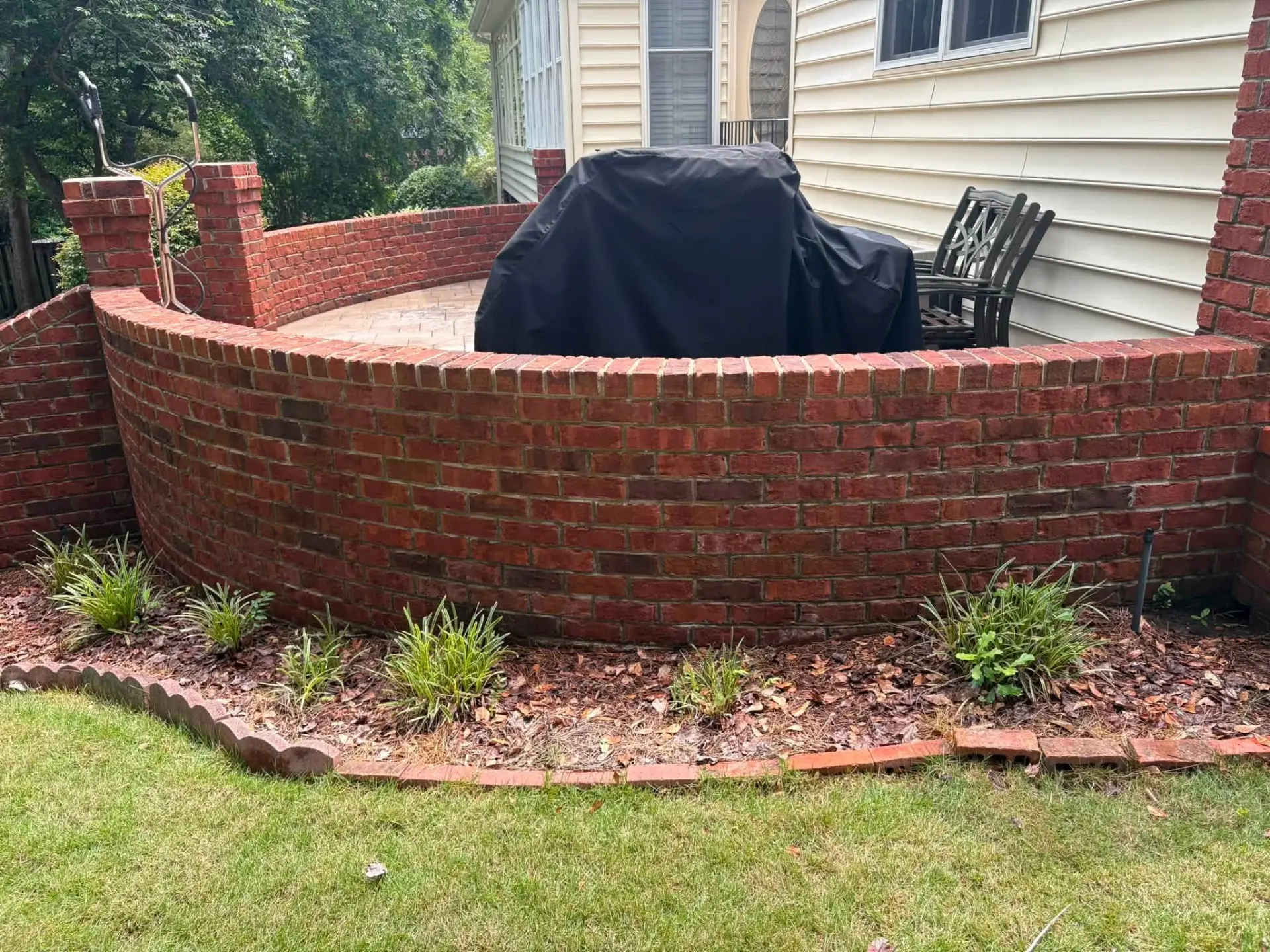 Brick Retaining Wall — drag to compare — after cleaning by FloPro Pressure Cleaning